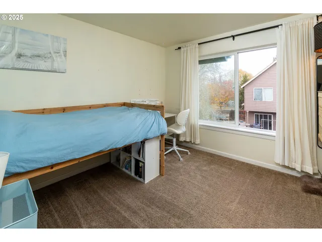 a bathroom with a granite countertop sink toilet and a mirror