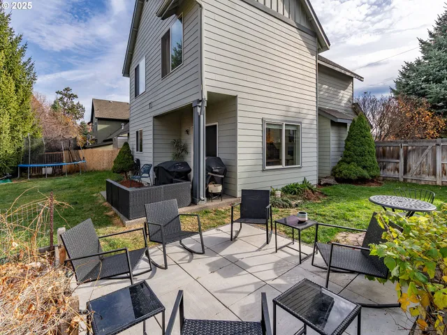a view of a garden with a lounge chair