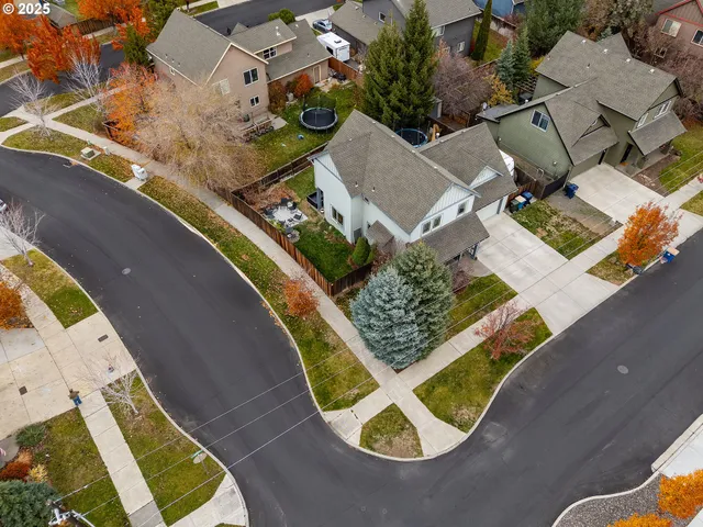 an aerial view of a house with a swimming pool