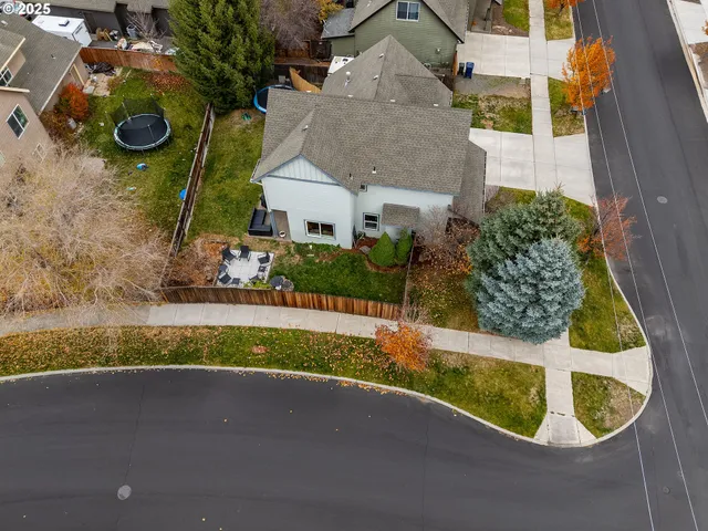 an aerial view of a house with outdoor space