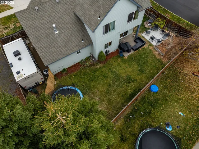 an aerial view of house with yard