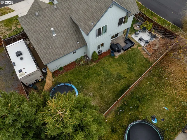 an aerial view of residential houses with outdoor space