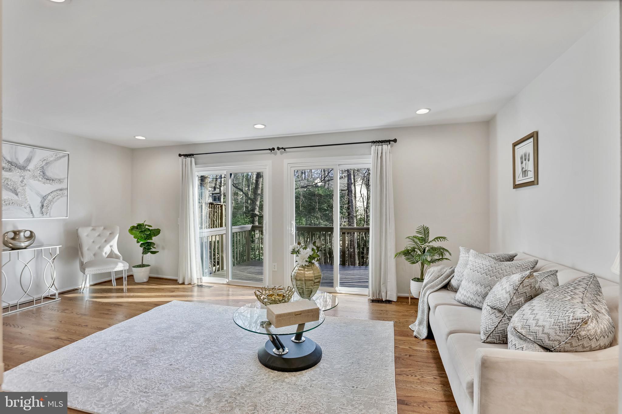 2257 Wheelwright Court Reston, VA 20191 - Photo 12 of 40 a living room with furniture and floor to ceiling windows