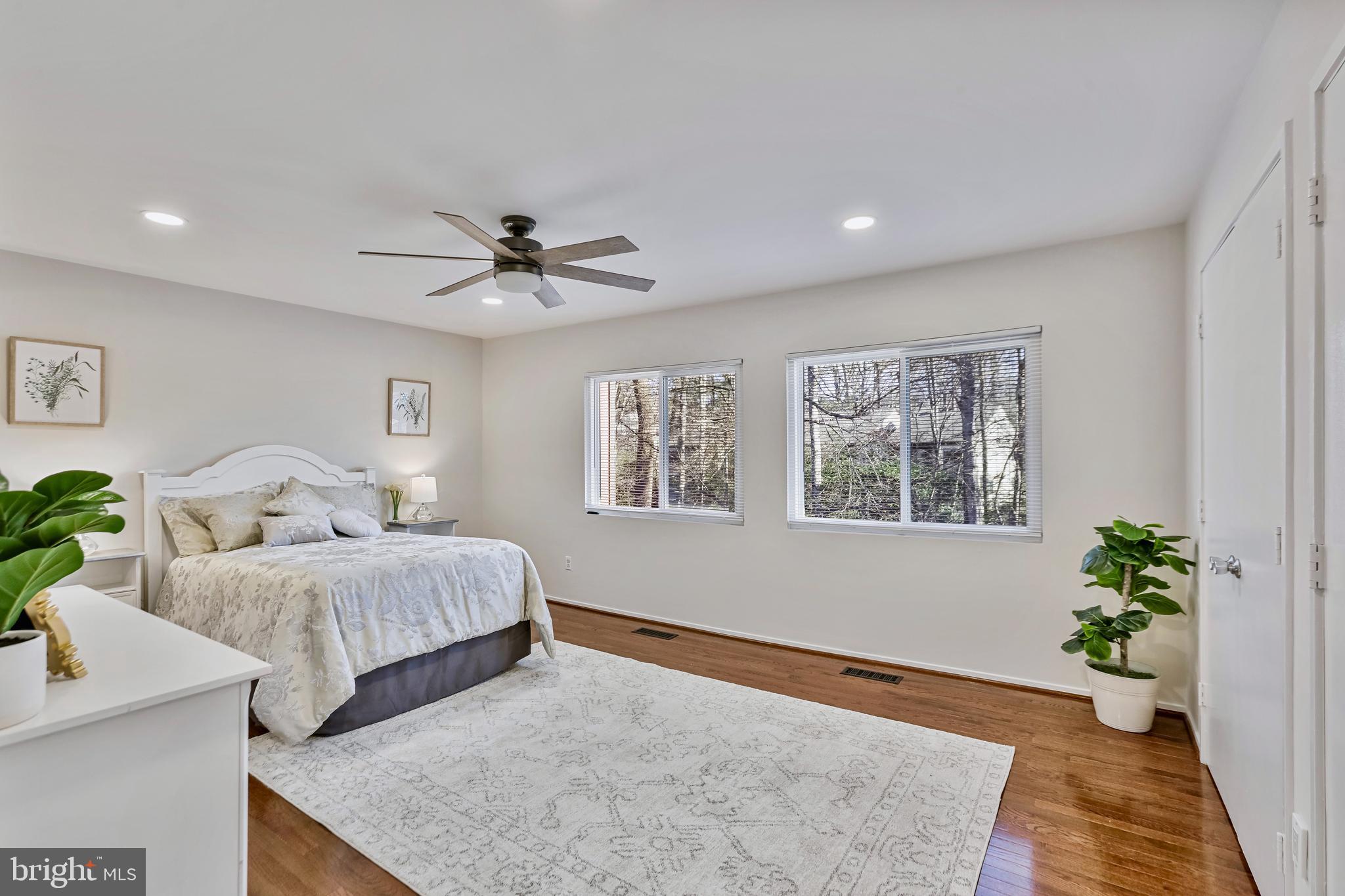2257 Wheelwright Court Reston, VA 20191 - Photo 18 of 40 a living room with two couches and a potted plant