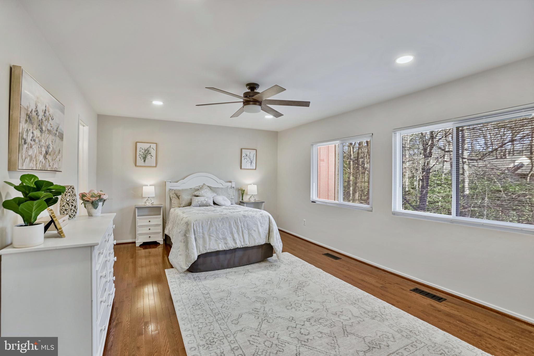 2257 Wheelwright Court Reston, VA 20191 - Photo 19 of 40 a spacious bedroom with a bed and a window