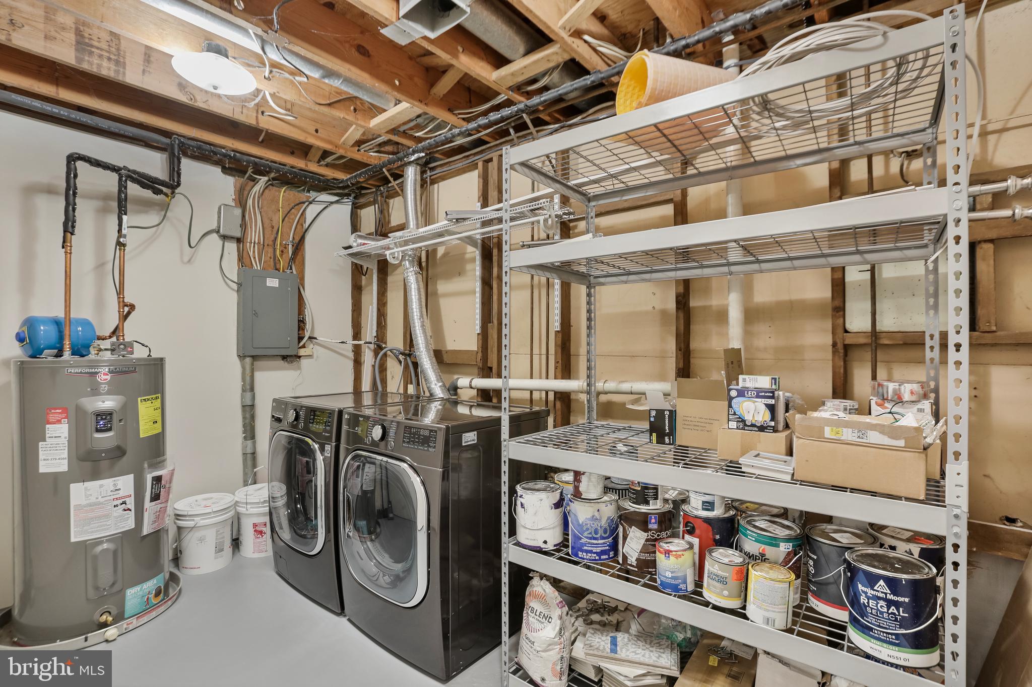 2257 Wheelwright Court Reston, VA 20191 - Photo 34 of 40 a utility room with dryer washer and a floor to ceiling window