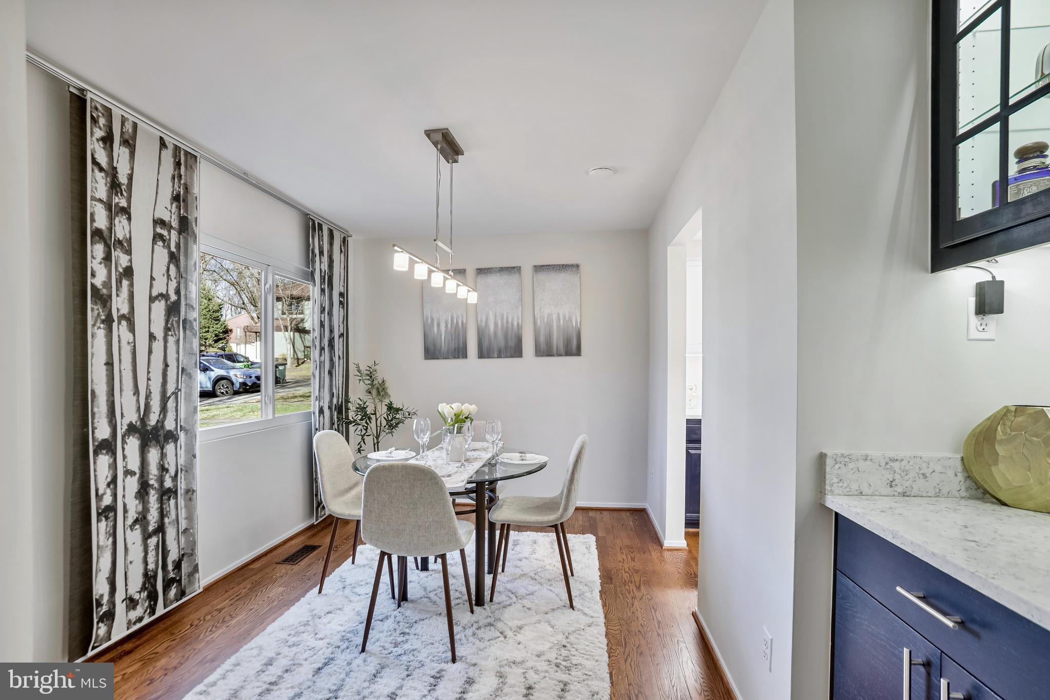 2257 Wheelwright Court Reston, VA 20191 - Photo 5 of 40 a view of a dining room with furniture window and wooden floor