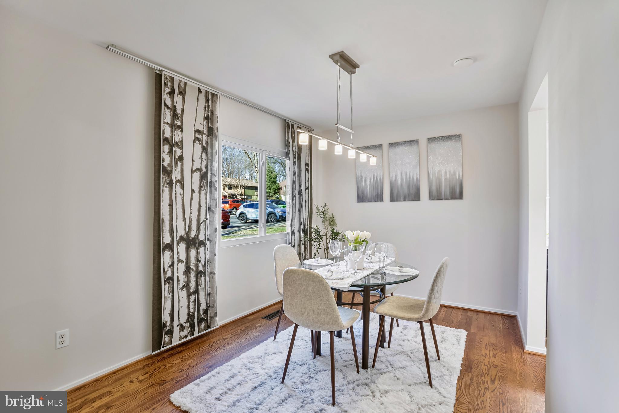 2257 Wheelwright Court Reston, VA 20191 - Photo 6 of 40 a view of a dining room with furniture window and wooden floor