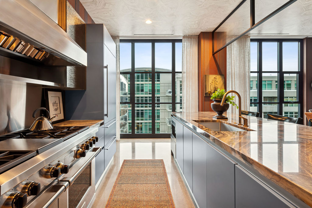 900 West Washington Boulevard, Unit 802 Chicago, IL 60607 - Photo 13 of 36 a kitchen with large windows and a sink