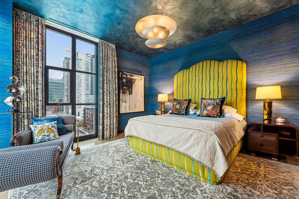 900 West Washington Boulevard, Unit 802 Chicago, IL 60607 - Photo 21 of 36 a bed sitting in a bedroom next to a window