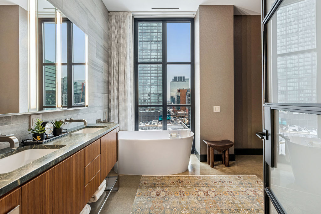 900 West Washington Boulevard, Unit 802 Chicago, IL 60607 - Photo 24 of 36 a bathroom with a sink and a bathtub