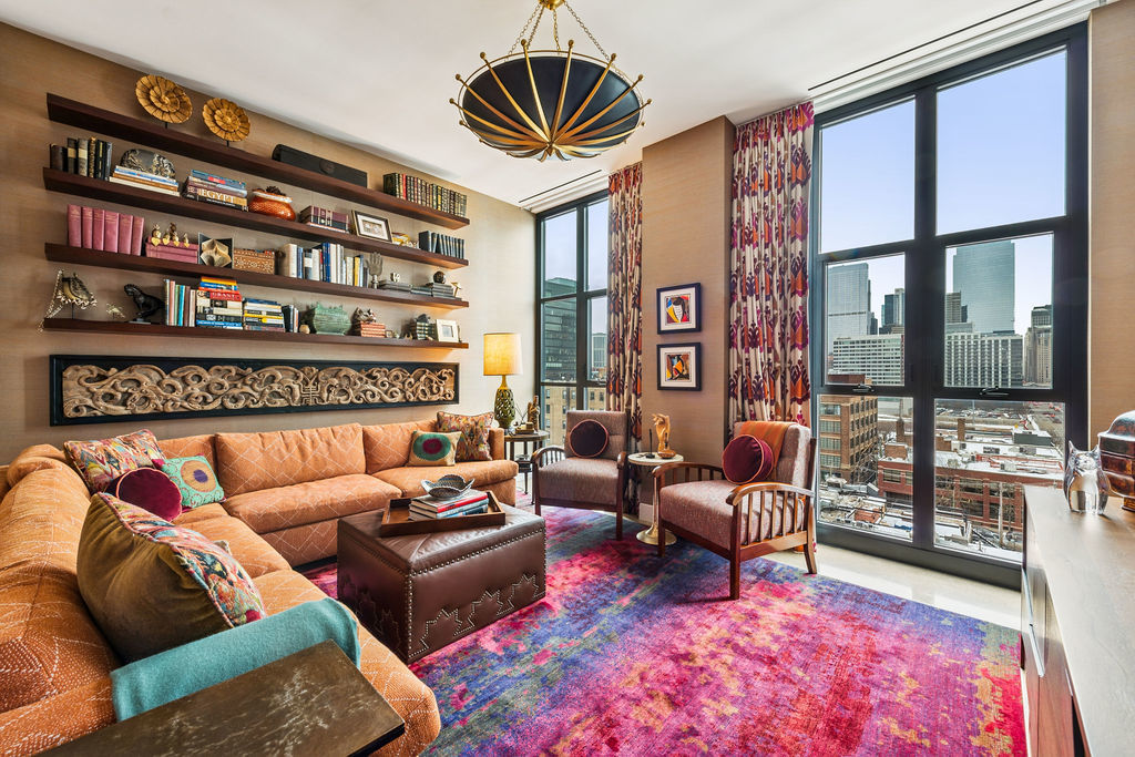 900 West Washington Boulevard, Unit 802 Chicago, IL 60607 - Photo 28 of 36 a living room with furniture a floor to ceiling window and a flat screen tv