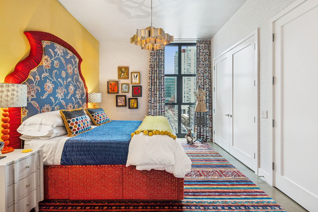 900 West Washington Boulevard, Unit 802 Chicago, IL 60607 - Photo 30 of 36 a bedroom with a bed and wooden floor