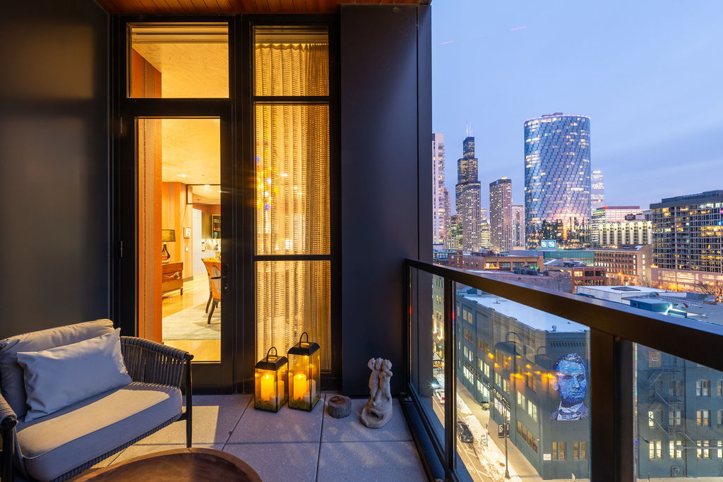 900 West Washington Boulevard, Unit 802 Chicago, IL 60607 - Photo 10 of 36 a view of a living room with a table and a window