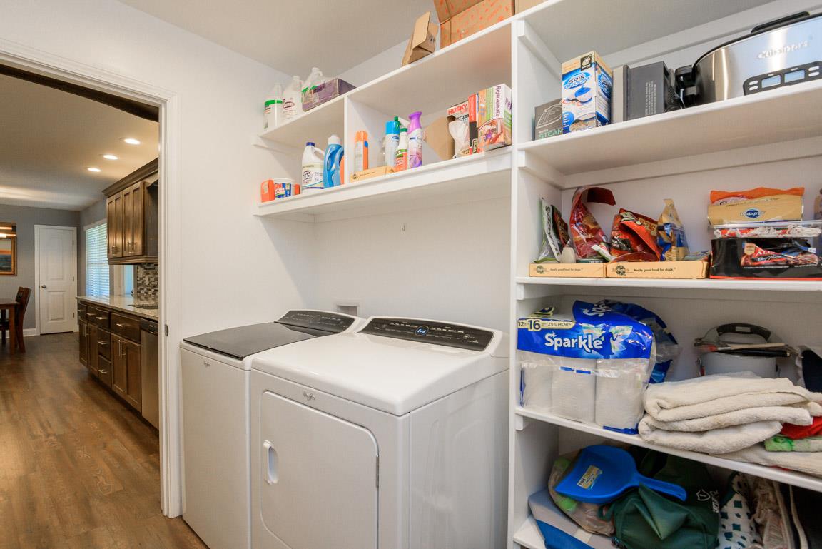 457 Goshen Road Lebanon, TN 37087 - Photo 20 of 30 a utility room with dryer washer and shoe rack