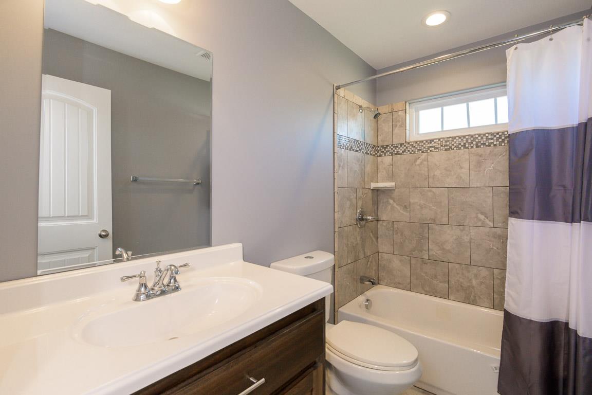 457 Goshen Road Lebanon, TN 37087 - Photo 24 of 30 a bathroom with a sink a toilet and bathtub
