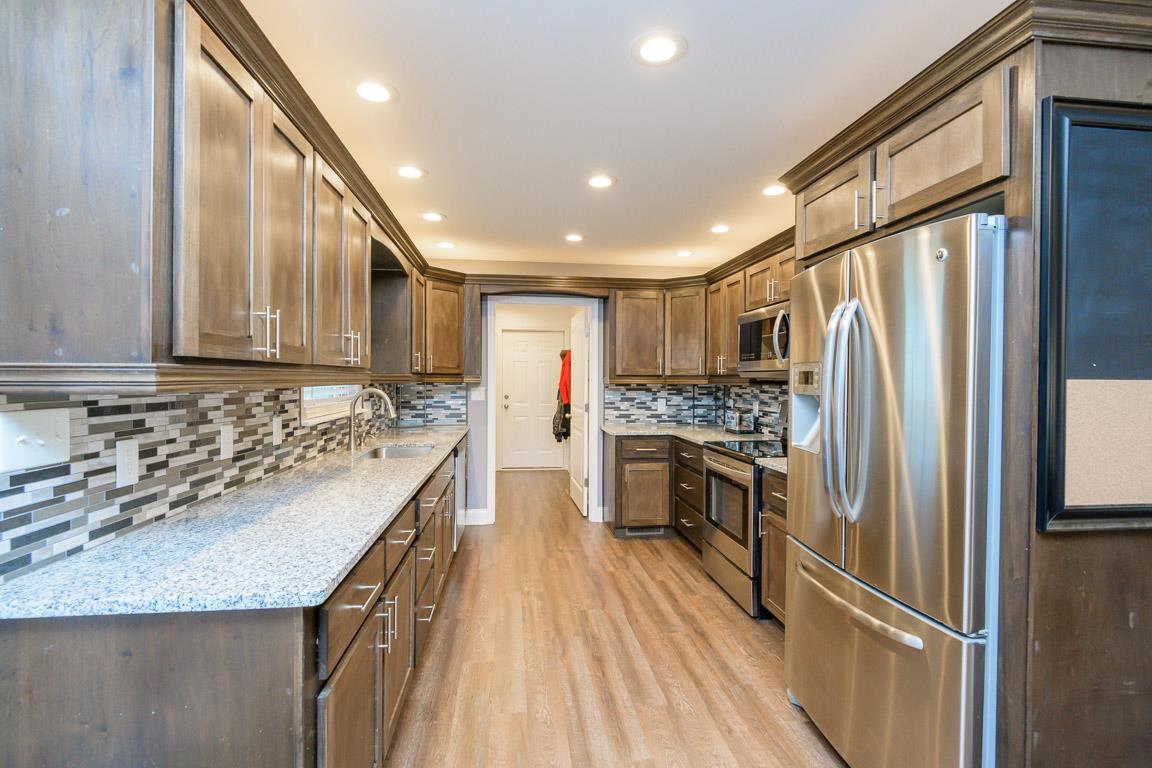 457 Goshen Road Lebanon, TN 37087 - Photo 8 of 30 a kitchen with stainless steel appliances granite countertop a refrigerator and a sink