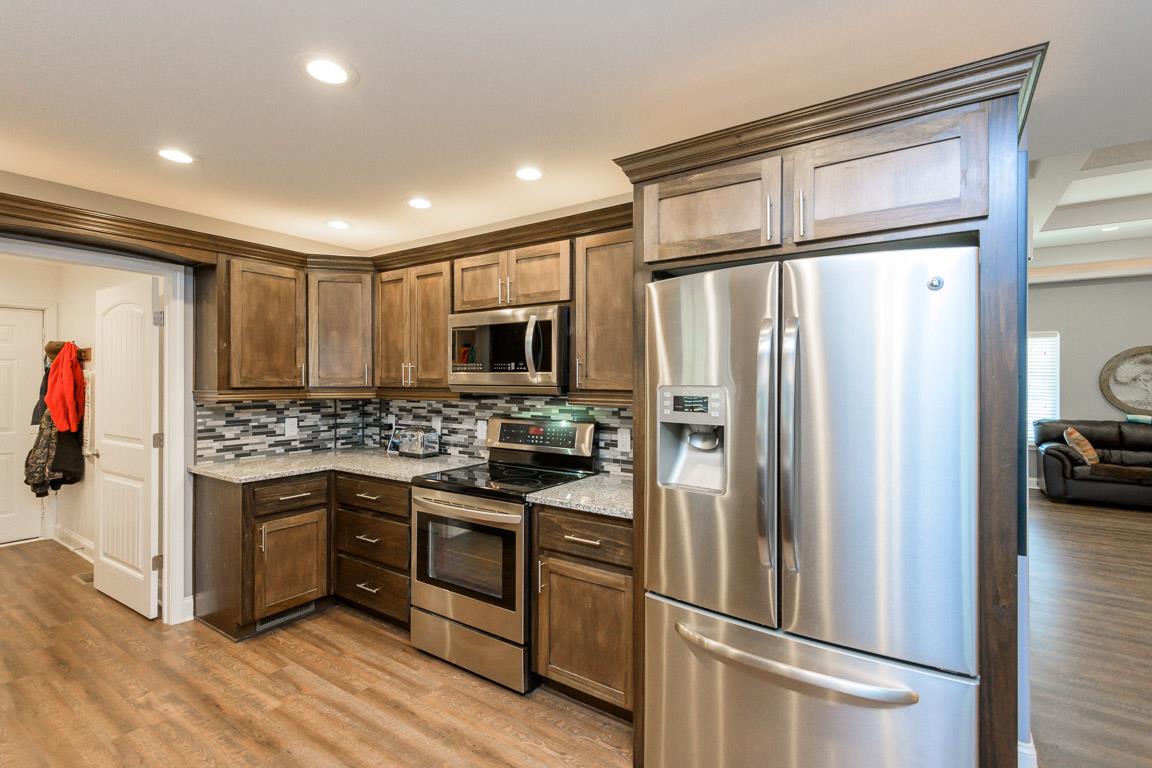 457 Goshen Road Lebanon, TN 37087 - Photo 9 of 30 a kitchen with stainless steel appliances granite countertop a refrigerator and a stove top oven