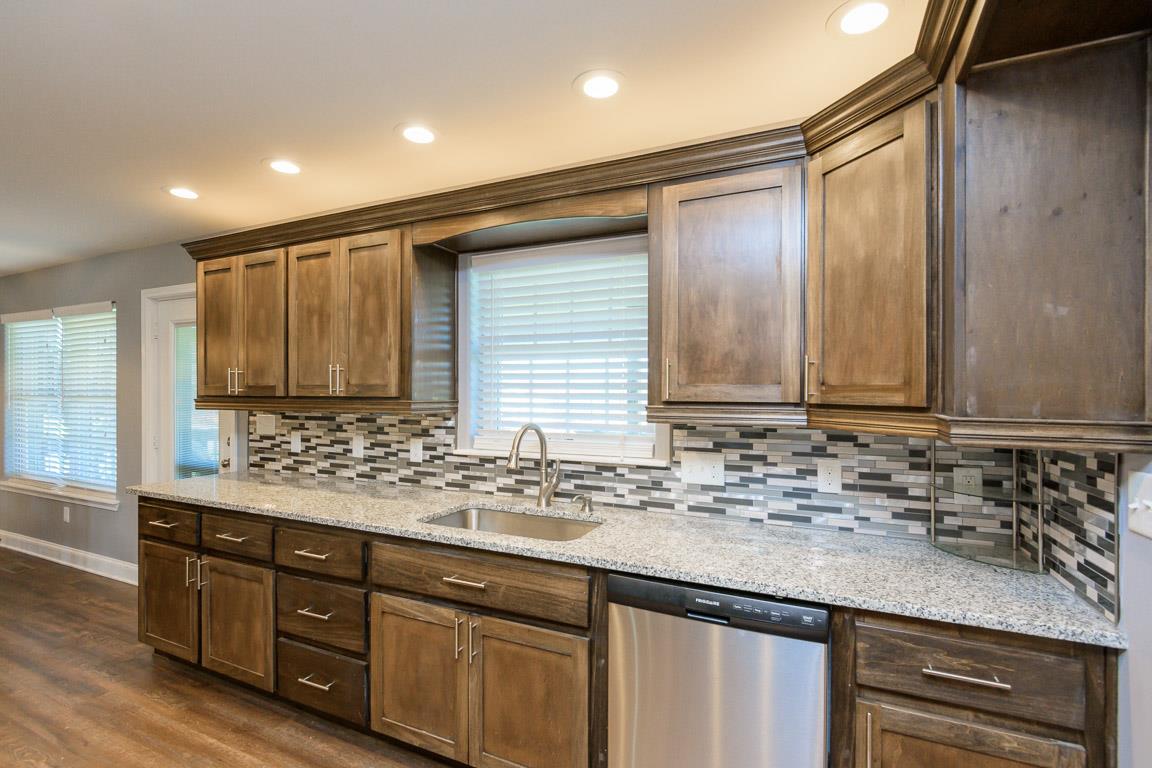 457 Goshen Road Lebanon, TN 37087 - Photo 10 of 30 a bathroom with a granite countertop sink and a mirror