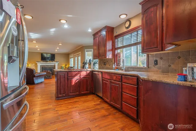 a kitchen with stainless steel appliances granite countertop lots of counter top space