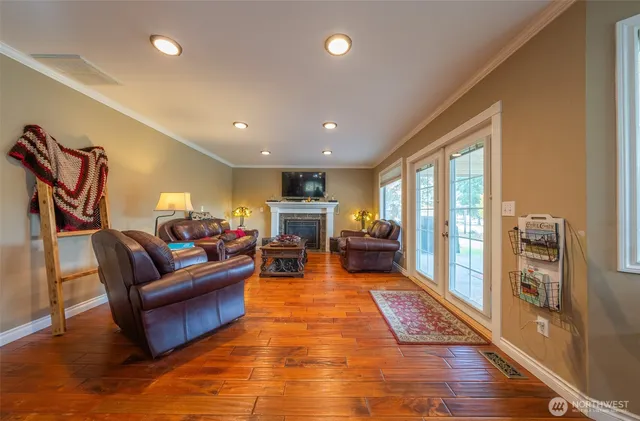 a living room with furniture window and wooden floor