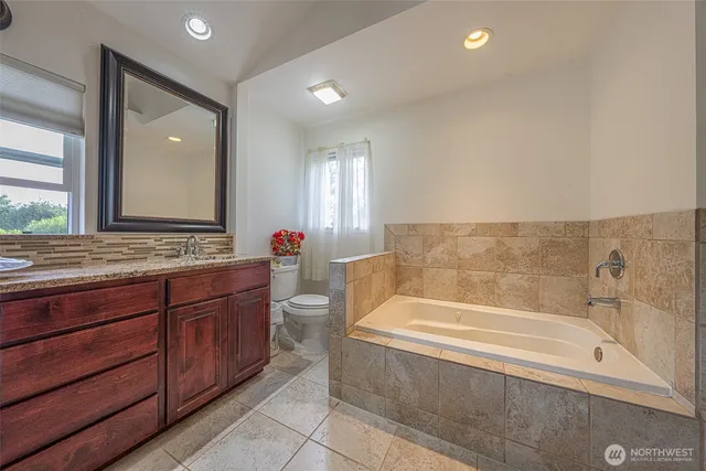 a bathroom with a bathtub and a sink