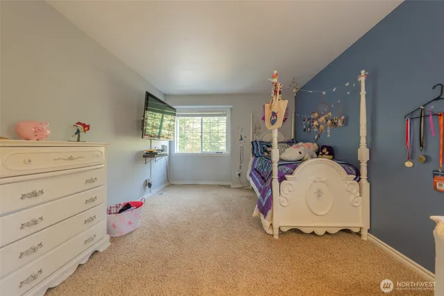 a view of room with baby crib and dresser
