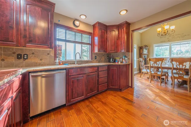 a kitchen with lots of counter top space and dining table