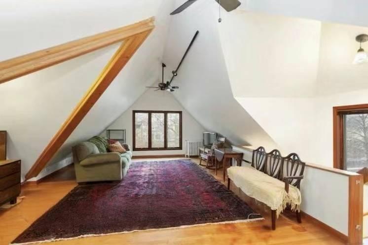 1433 Bay Ridge Parkway Brooklyn, NY 11228 - Photo 3 of 8 a living room with furniture and a rug