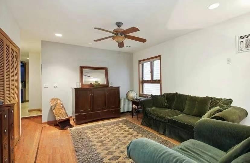 1433 Bay Ridge Parkway Brooklyn, NY 11228 - Photo 4 of 8 a living room with furniture and a window