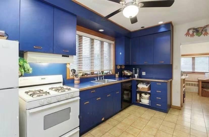 1433 Bay Ridge Parkway Brooklyn, NY 11228 - Photo 5 of 8 a kitchen with a cabinets and white appliances