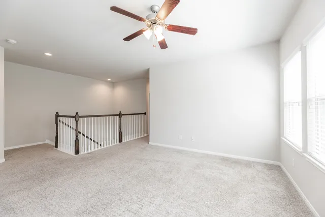 a view of a hallway with a window