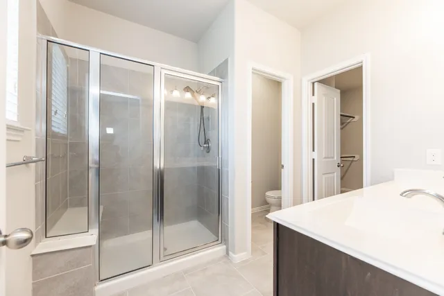 a bathroom with a sink double vanity and a mirror