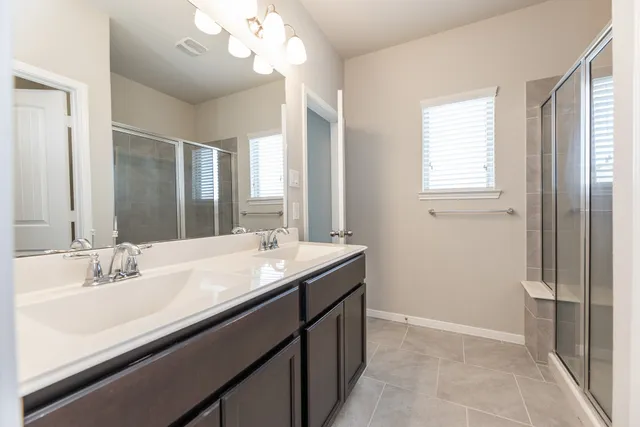 a bathroom with a sink a vanity and a mirror