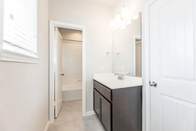 a bathroom with a bathtub and a toilet