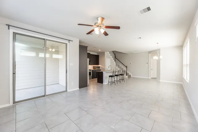 a view of livingroom with hardwood floor and a ceiling fan