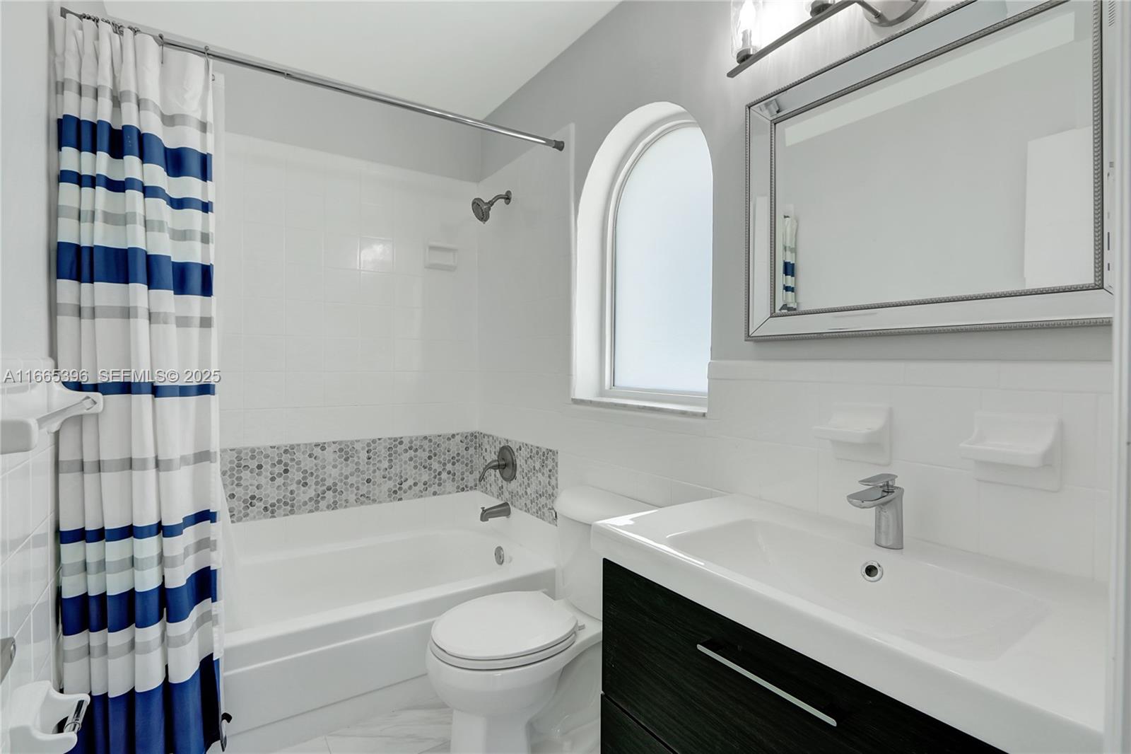 1359 Southwest 11th Street Miami, FL 33135 - Photo 13 of 25 a bathroom with a bathtub a sink and a shower