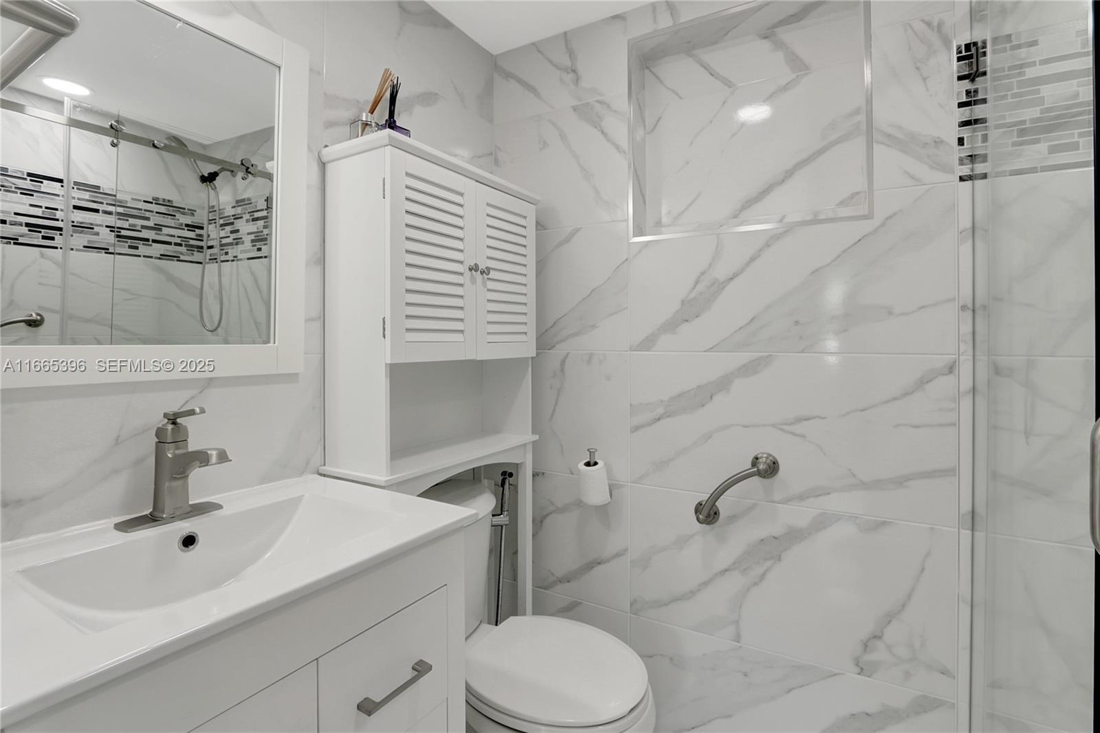 1359 Southwest 11th Street Miami, FL 33135 - Photo 16 of 25 a bathroom with a sink toilet and shower