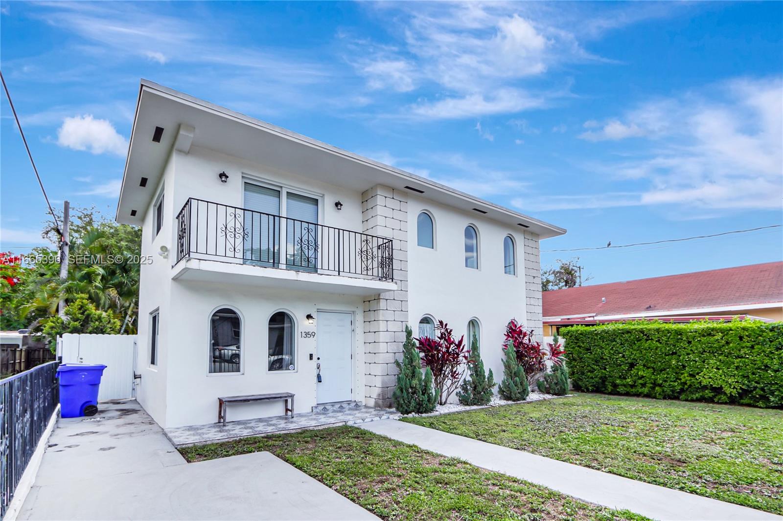 1359 Southwest 11th Street Miami, FL 33135 - Photo 2 of 25 a front view of a house with a yard