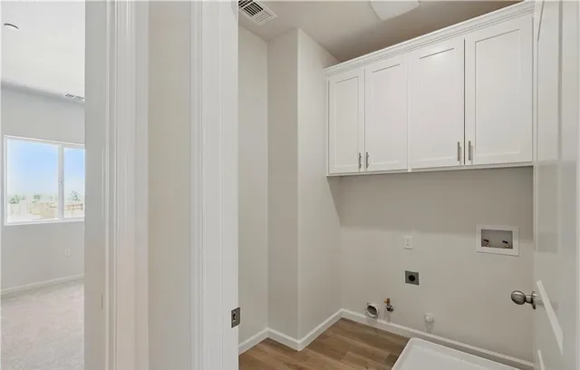 a bathroom with a granite countertop sink a toilet a mirror and a vanity