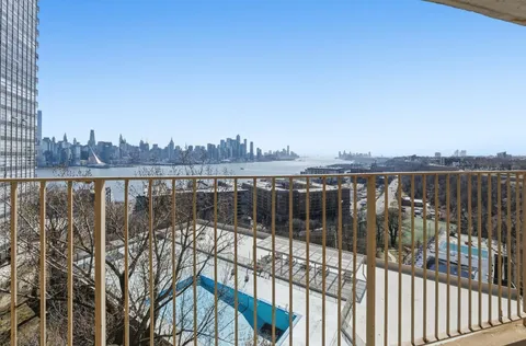 a view of balcony with city