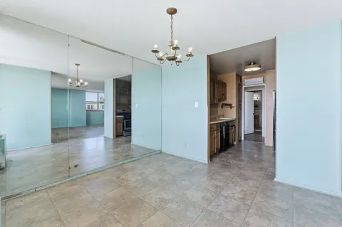 a bathroom with a granite countertop toilet and a sink