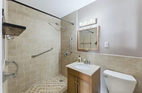 a view of a kitchen with a sink and cabinets