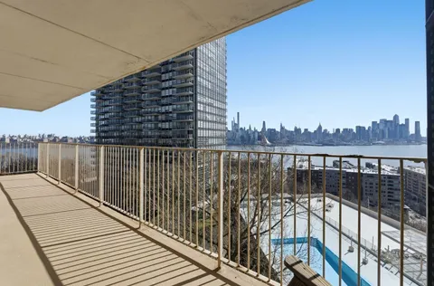 a view of balcony with wooden floor