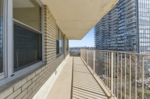 a view of balcony with furniture