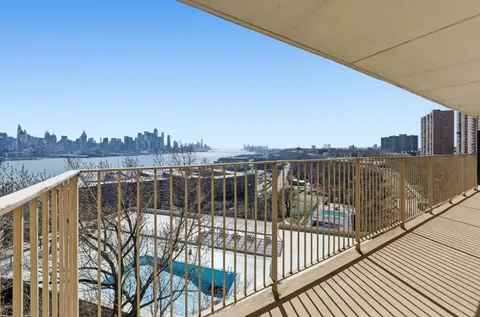 a view of an empty room with windows