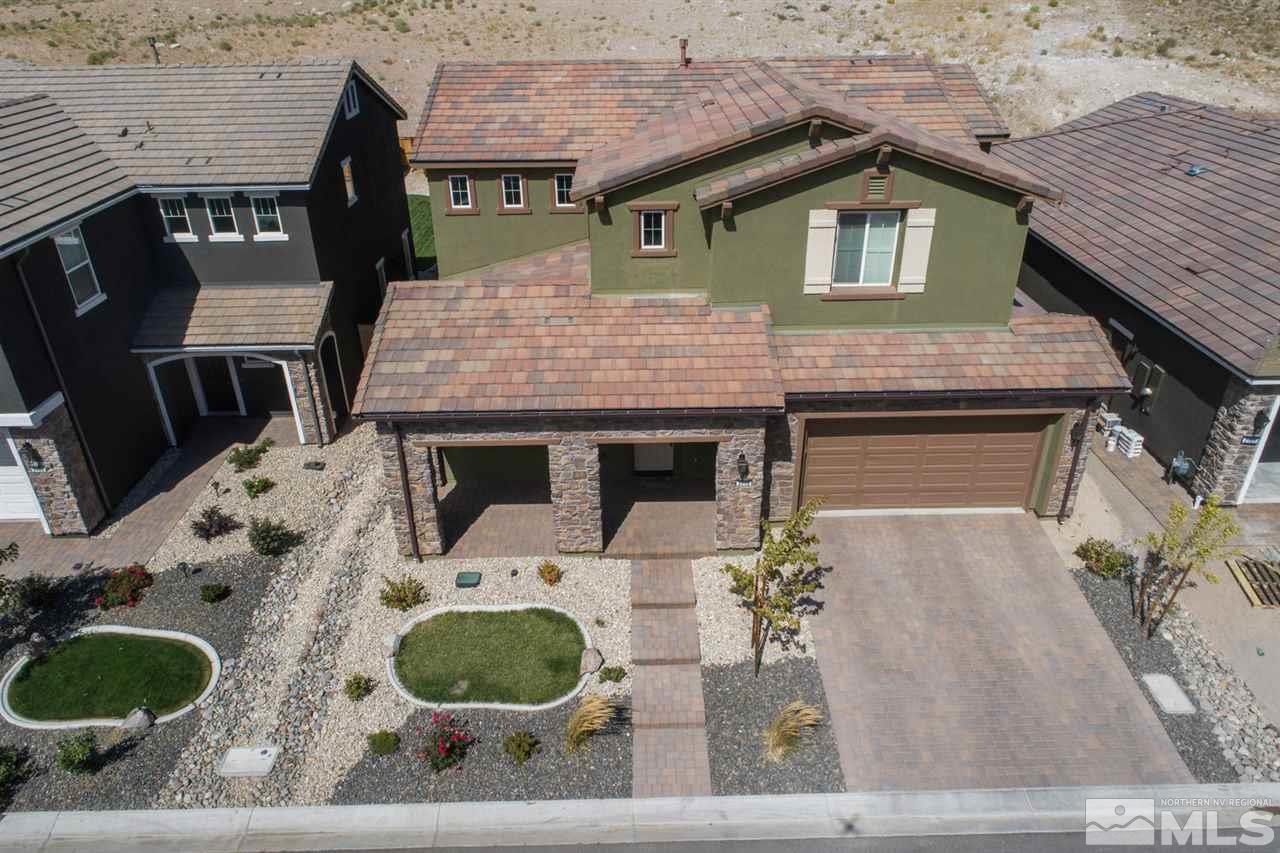3115 Show Jumper Lane Reno, NV 89521 - Photo 1 of 25 a front view of a house with garden and plants
