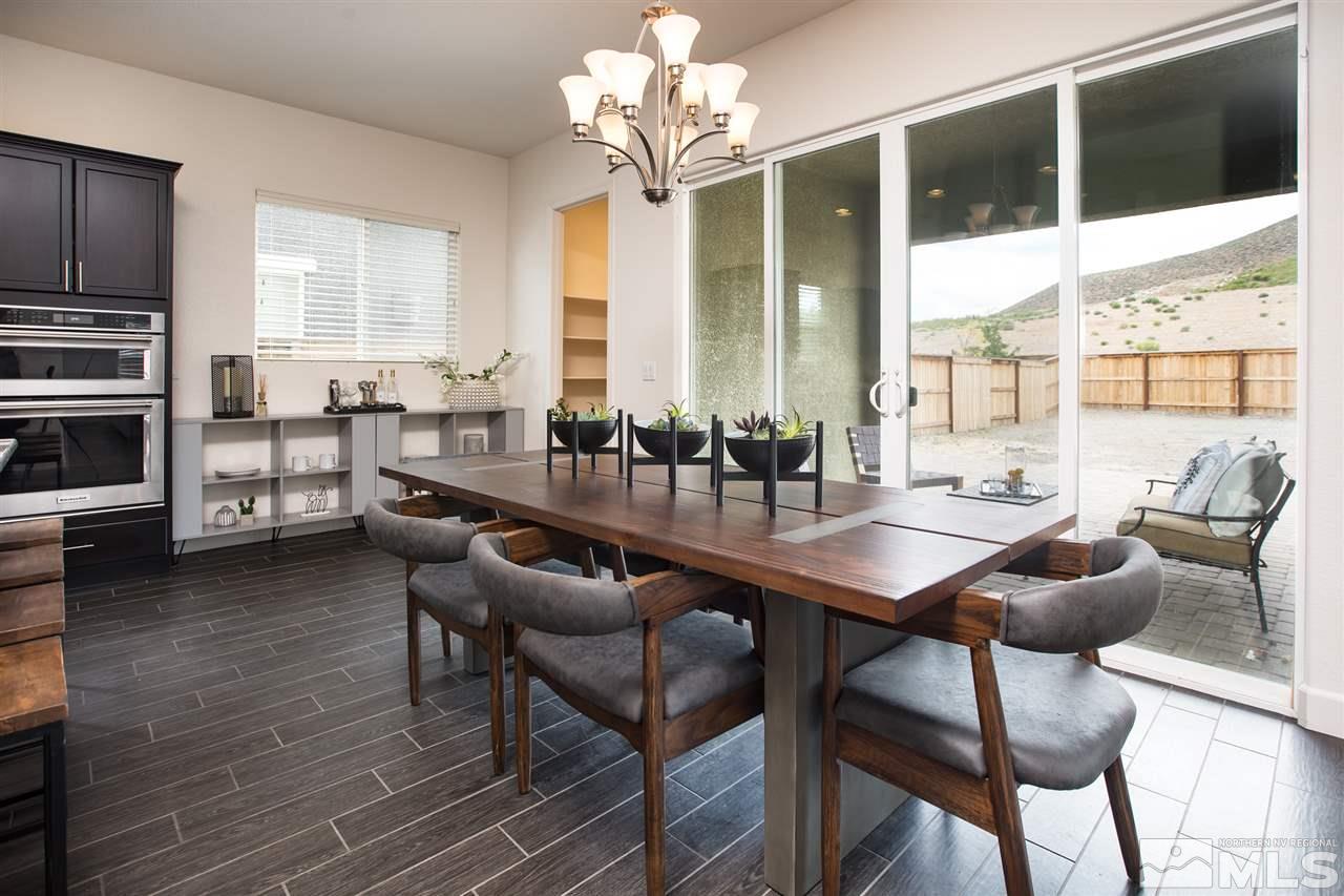 3115 Show Jumper Lane Reno, NV 89521 - Photo 11 of 25 a view of a dining room with furniture window and outside view