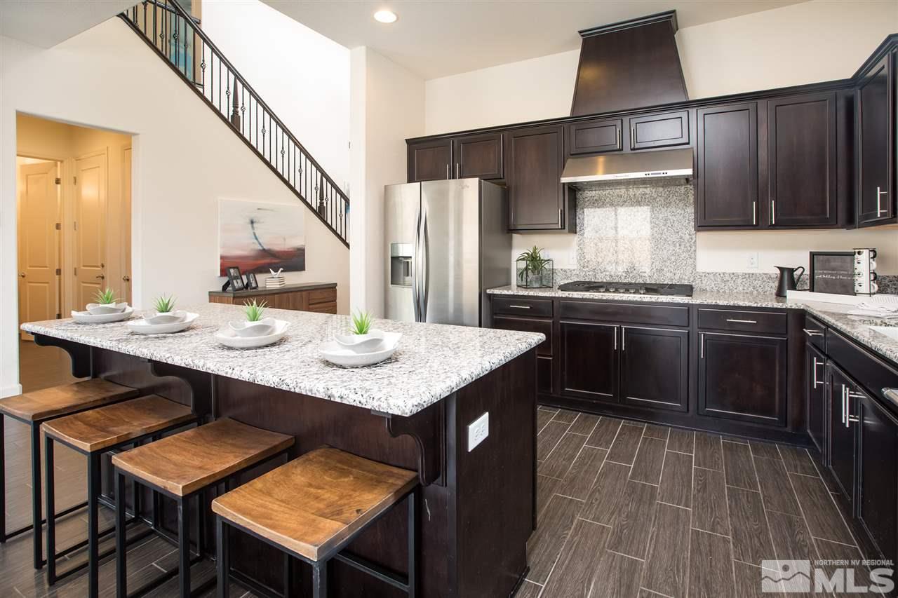 3115 Show Jumper Lane Reno, NV 89521 - Photo 12 of 25 a kitchen with granite countertop a sink appliances and cabinets