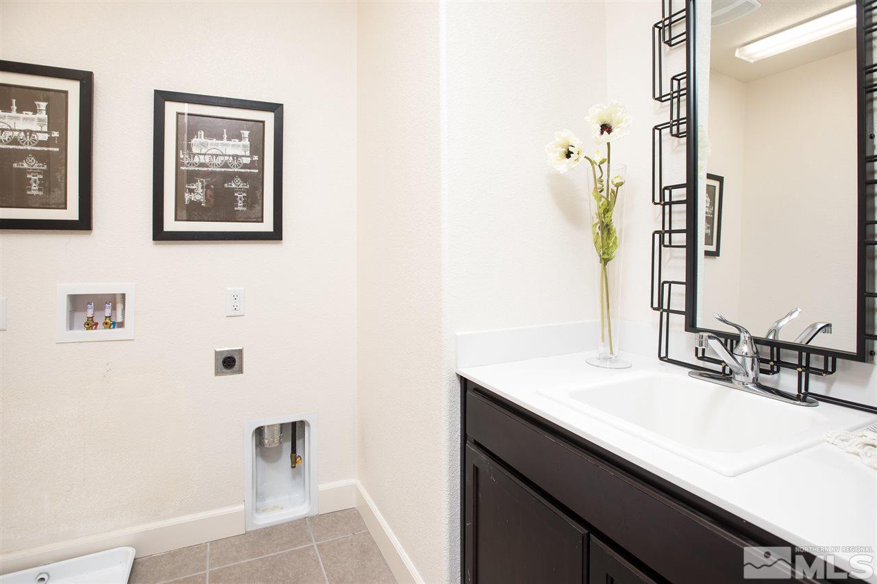 3115 Show Jumper Lane Reno, NV 89521 - Photo 14 of 25 a bathroom with a sink and a mirror